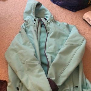 A blue windbreaker coat